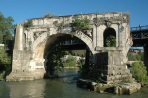 The remaining arch of the Pons Aemilius located in the middle of the Tiber